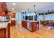 Gourmet kitchen with custom cabinets, stainless appliances, and a center island with granite countertops at 981 Cranbrook Glen Ln, Snellville, GA 30078