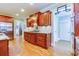 Spacious kitchen with wood cabinets, stainless steel refrigerator and granite countertops at 981 Cranbrook Glen Ln, Snellville, GA 30078