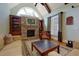 Comfortable living room with stone fireplace, large window, and vaulted ceilings at 981 Cranbrook Glen Ln, Snellville, GA 30078