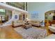 Elegant living room boasts a two-story layout and hardwood floors, perfect for relaxation and entertaining at 981 Cranbrook Glen Ln, Snellville, GA 30078