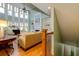Well-lit living room with soaring ceilings, large windows, and built-in shelving flanking the fireplace at 981 Cranbrook Glen Ln, Snellville, GA 30078