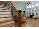 Beautiful staircase leading to a spacious living room with high ceilings and lots of windows at 981 Cranbrook Glen Ln, Snellville, GA 30078
