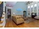 Bright living room featuring a two-story wall of windows, hardwood floors, and an open layout at 981 Cranbrook Glen Ln, Snellville, GA 30078