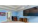 Relaxing main bedroom featuring light-blue walls, a TV, and a cozy sitting area at 981 Cranbrook Glen Ln, Snellville, GA 30078