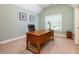 Bright office featuring a large wooden desk and natural light from a window at 981 Cranbrook Glen Ln, Snellville, GA 30078