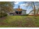 Wide backyard featuring a spacious deck with an umbrella at 5355 Avonshire Ln, Cumming, GA 30040