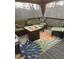 Inviting deck area with comfortable seating, fire pit, and colorful rug at 5355 Avonshire Ln, Cumming, GA 30040