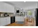 Bright kitchen with white cabinets and a breakfast area at 5355 Avonshire Ln, Cumming, GA 30040