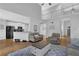 Spacious living area with high ceilings and an open floor plan leading to the kitchen at 5355 Avonshire Ln, Cumming, GA 30040