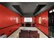 Home theater featuring reclining seating, a large screen, and dramatic lighting at 5355 Avonshire Ln, Cumming, GA 30040