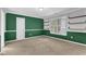 Room with green walls, a large window, and white trim at 5355 Avonshire Ln, Cumming, GA 30040