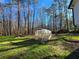 Large backyard with greenhouse and trees at 621 Hood Rd, Stockbridge, GA 30281