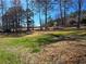 Spacious backyard with mature trees providing ample shade, enhancing the property's appeal at 621 Hood Rd, Stockbridge, GA 30281