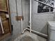 Unfinished basement features exposed plumbing and a concrete foundation at 621 Hood Rd, Stockbridge, GA 30281