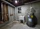 The unfinished basement has a water heater and wash basin at 621 Hood Rd, Stockbridge, GA 30281