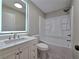 Beautiful bathroom with modern vanity, LED mirror, and a shower-tub combination at 621 Hood Rd, Stockbridge, GA 30281