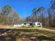 Charming ranch-style home with a two-car garage and well-maintained lawn at 621 Hood Rd, Stockbridge, GA 30281