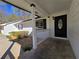 Inviting front porch with white railings and a decorative black front door at 621 Hood Rd, Stockbridge, GA 30281