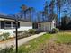 Beautiful front yard with landscaping and a well-lit walkway to the front porch at 621 Hood Rd, Stockbridge, GA 30281