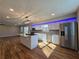 Kitchen with stainless steel appliances, a large island with sink and seating at 621 Hood Rd, Stockbridge, GA 30281