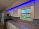 Granite countertops compliment the modern kitchen design and the beautiful outdoor view at 621 Hood Rd, Stockbridge, GA 30281