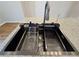 Close-up of a modern kitchen sink with accessories on a granite countertop at 621 Hood Rd, Stockbridge, GA 30281