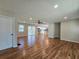Well-lit living room featuring hardwood floors, recessed lighting, and access to the outdoor deck at 621 Hood Rd, Stockbridge, GA 30281