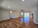 Spacious living room with hardwood floors, ceiling fan, and sliding glass doors to a deck at 621 Hood Rd, Stockbridge, GA 30281