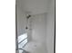 Updated bathroom with new shower including a multi-setting shower head and built-in shelves at 621 Hood Rd, Stockbridge, GA 30281