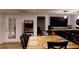 Finished basement with walkout door, bar area, and PacMan arcade game at 30 Woodbrook Ct, Mcdonough, GA 30252