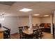 Finished basement featuring a dining area, bar and lounge area with a leather sofa at 30 Woodbrook Ct, Mcdonough, GA 30252