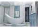 Modern bathroom featuring a freestanding bathtub and designer tiles at 30 Woodbrook Ct, Mcdonough, GA 30252