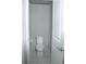 A half-bathroom with a white toilet and neutral paint on the walls at 30 Woodbrook Ct, Mcdonough, GA 30252