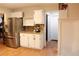 A convenient kitchenette boasting stainless steel appliances, custom cabinets, and granite countertops at 30 Woodbrook Ct, Mcdonough, GA 30252