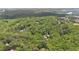 Aerial view of forested neighborhood with homes interspersed among the dense trees at 950 Ivy St, Cumming, GA 30041