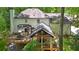 Aerial view of the deck overlooking an expansive wooded backyard at 950 Ivy St, Cumming, GA 30041