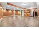 Finished basement with wood floors, kitchenette, and ample open space at 950 Ivy St, Cumming, GA 30041