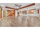 Spacious basement with wood floors, ceiling fan, and white support pillars at 950 Ivy St, Cumming, GA 30041