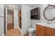 Cozy bathroom with a shower, vanity, and dark wood accents at 950 Ivy St, Cumming, GA 30041