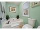 Bright bathroom featuring a tub, window, and serene decor for a relaxing space at 950 Ivy St, Cumming, GA 30041