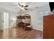 Bunk beds in a bedroom with wood floors, ceiling fan and a window at 950 Ivy St, Cumming, GA 30041