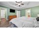 Bedroom featuring bright natural light and tray ceiling at 950 Ivy St, Cumming, GA 30041