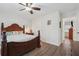 Bedroom showcases a ceiling fan, hardwood floors, and a decorative headboard at 950 Ivy St, Cumming, GA 30041