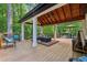 The covered deck with a wood ceiling has lots of room for entertaining and enjoying the outdoors at 950 Ivy St, Cumming, GA 30041
