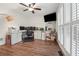 Bright home office has a custom workstation, built-in storage, and natural light from shuttered windows at 950 Ivy St, Cumming, GA 30041