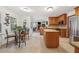 Open floor plan shows the kitchen featuring granite countertops, a dining area and a brick fireplace at 950 Ivy St, Cumming, GA 30041