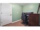 Home office area with wood-look floors and a neutral color palette at 950 Ivy St, Cumming, GA 30041