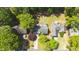 Aerial view showcasing the home's roof, backyard, deck, and mature landscaping at 3107 Sandhurst Dr, Woodstock, GA 30189