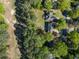 Aerial shot highlighting proximity to the golf course and surrounding mature trees at 3107 Sandhurst Dr, Woodstock, GA 30189