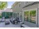 Back exterior view featuring a grey exterior, deck with outdoor seating, and lush landscaping at 3107 Sandhurst Dr, Woodstock, GA 30189